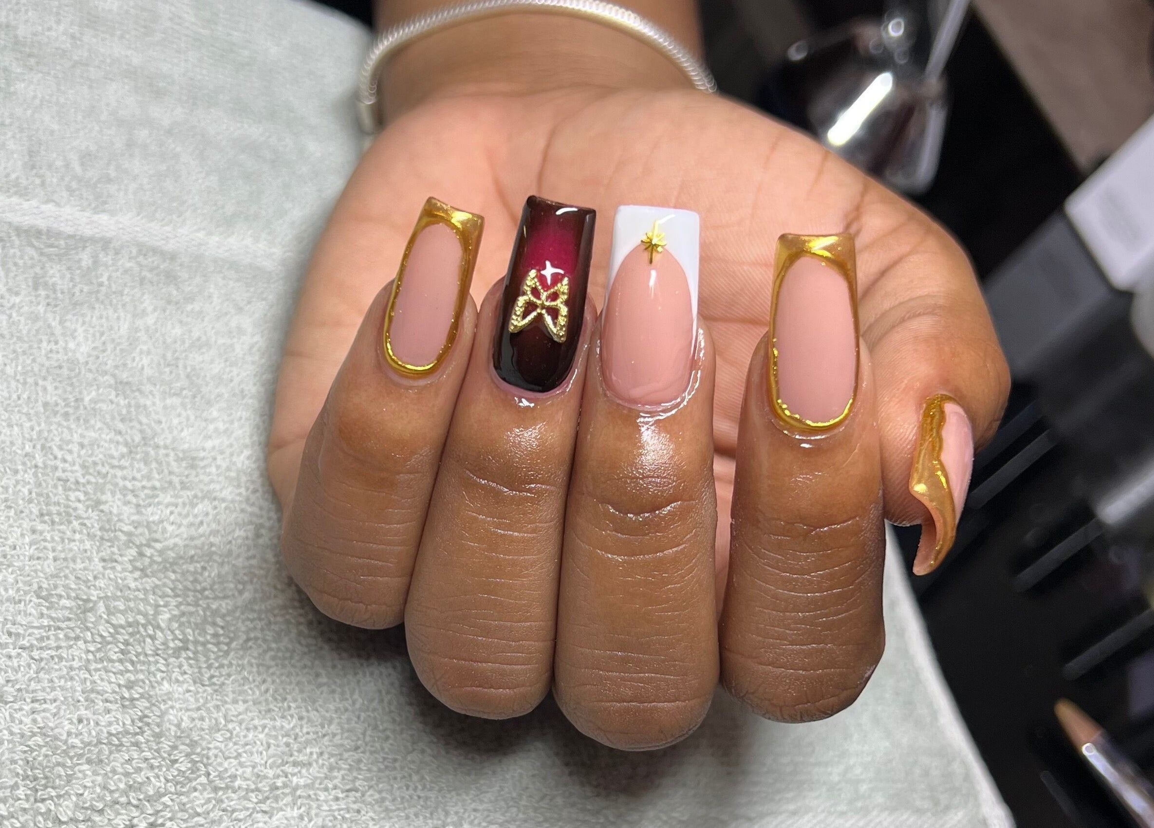 Stunning gold-accented nail art at Luxe Nails by Sher, Montego Bay, St. James Parish, JM.
