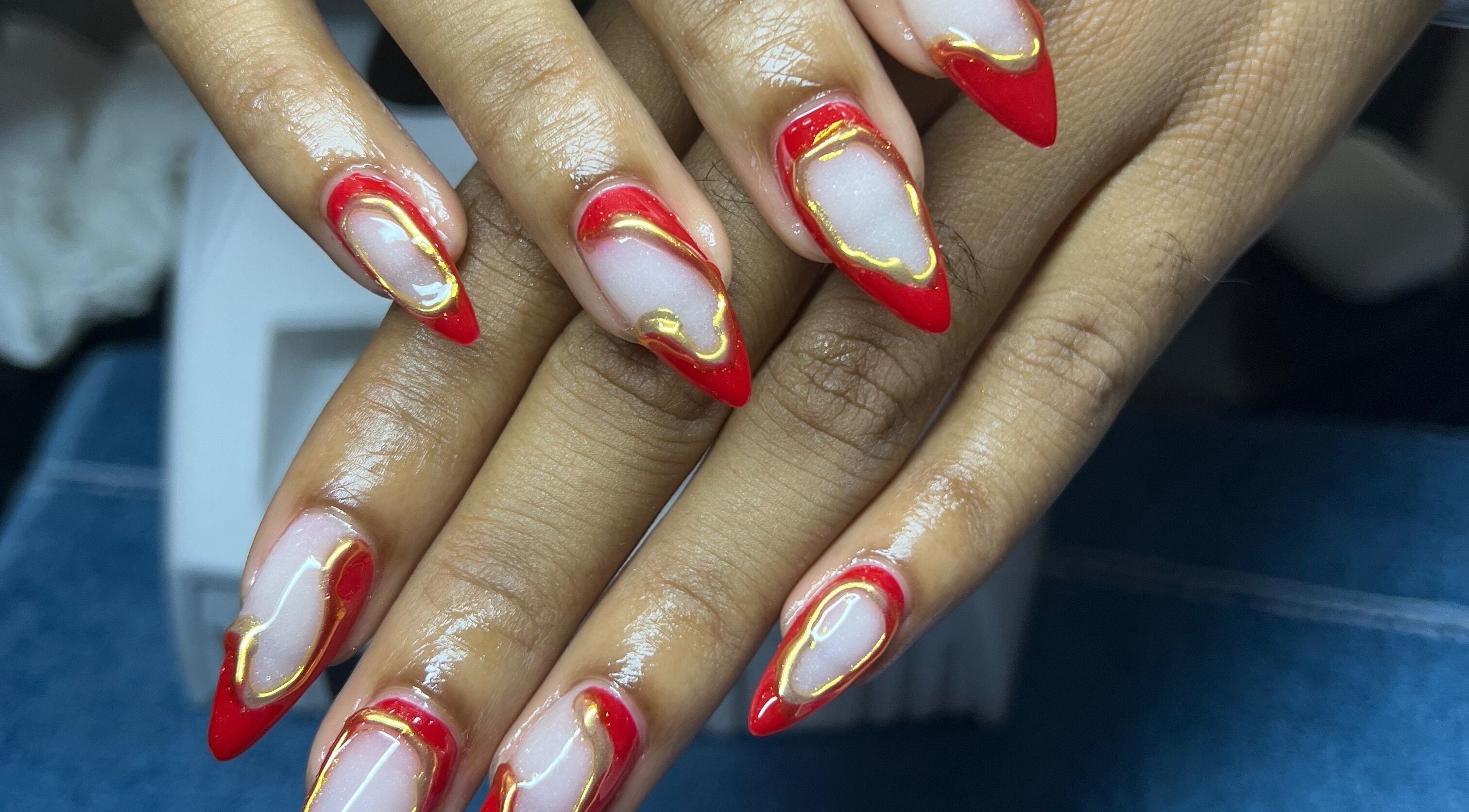Elegant red and gold nail art at Luxe nails by Sher, Montego Bay, St. James Parish, JM.