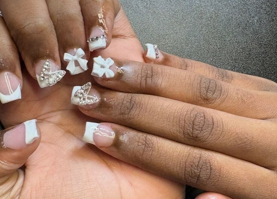 Elegant butterfly nail art at PolishedByQ in Beltsville, Maryland, US. Perfect for a stylish flair.