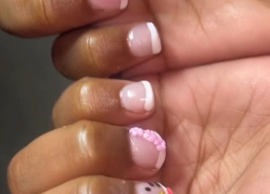 Elegant French manicure with nail art at PolishedByQ, Beltsville, Maryland, US.