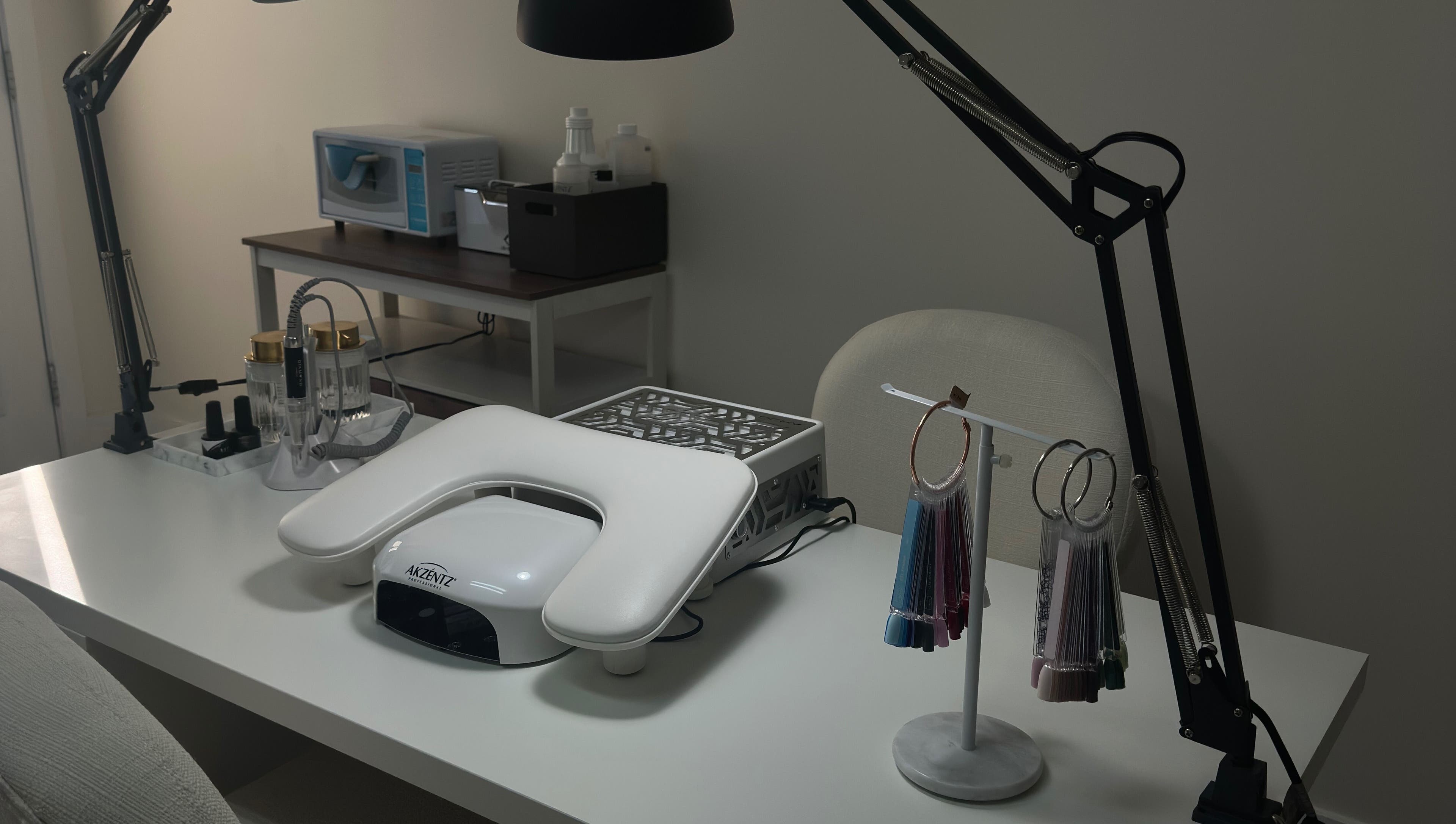 Modern nail desk setup at My Balance nail studio in Thornhill, Ontario, CA featuring sleek tools and equipment.