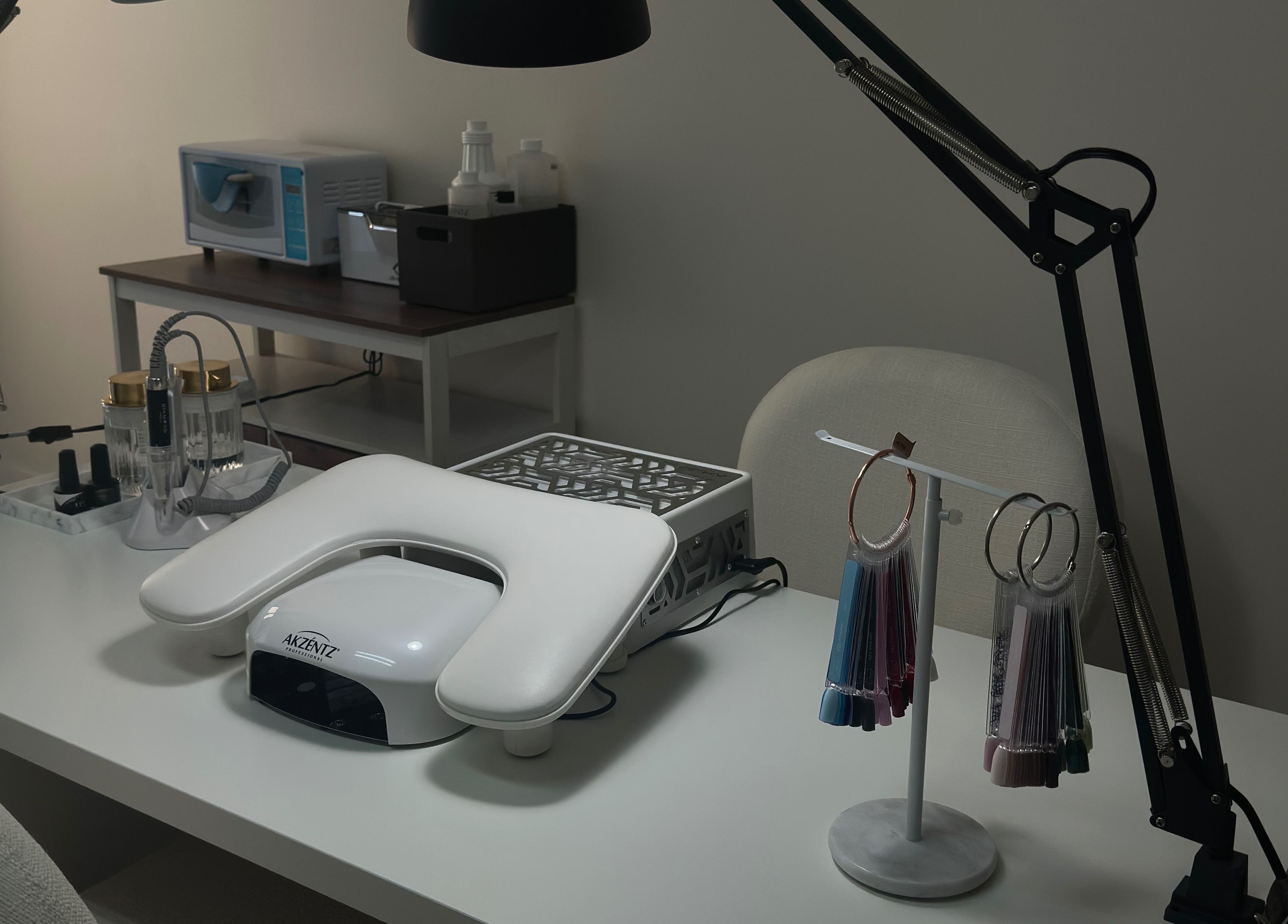 Modern nail desk setup at My Balance nail studio in Thornhill, Ontario, CA featuring sleek tools and equipment.