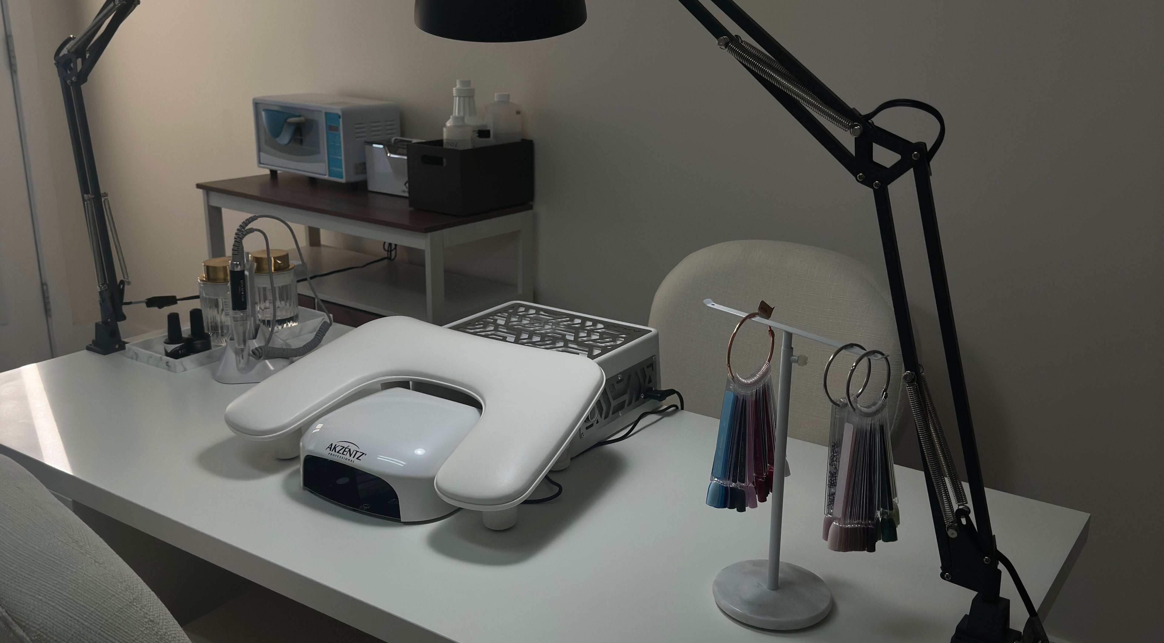 Modern nail desk setup at My Balance nail studio in Thornhill, Ontario, CA featuring sleek tools and equipment.