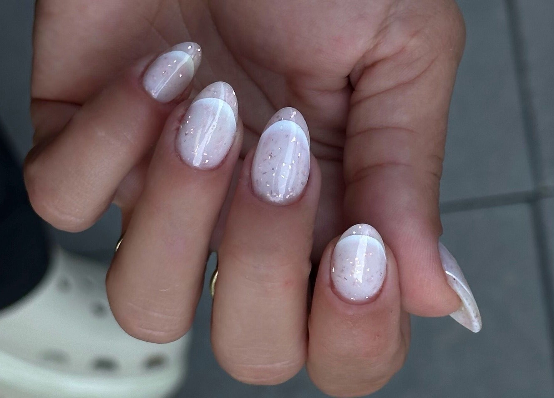 Elegant white manicure with glitter at My Balance nail studio in Thornhill, Ontario, CA.