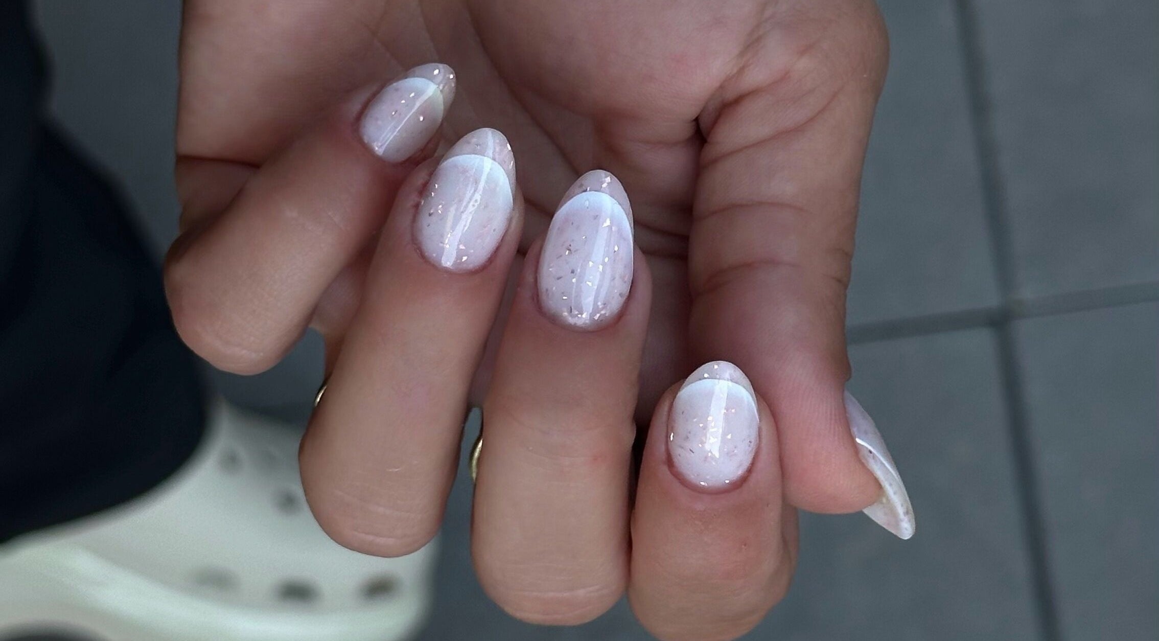 Elegant white manicure with glitter at My Balance nail studio in Thornhill, Ontario, CA.