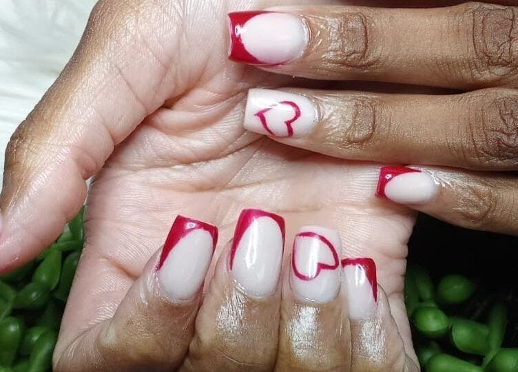 Stylish red and white nail art at LuxeBeautyParlour in Centurion, Gauteng, ZA. Elegance meets creativity.