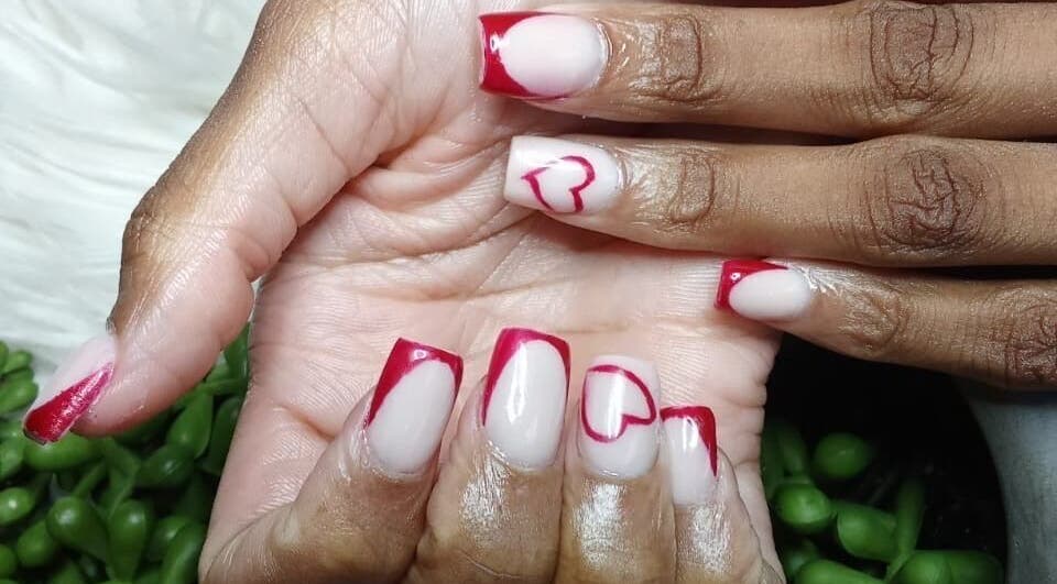 Stylish red and white nail art at LuxeBeautyParlour in Centurion, Gauteng, ZA. Elegance meets creativity.