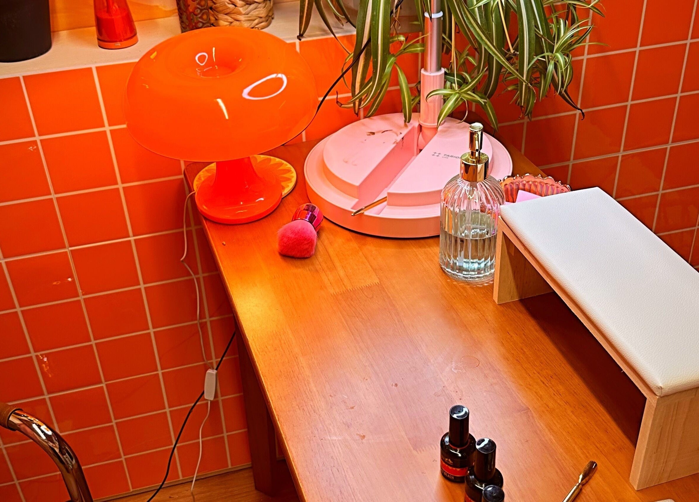 Chic nail station at Emily Gossip Nails, Winscombe, England, GB with vibrant decor and nail supplies.