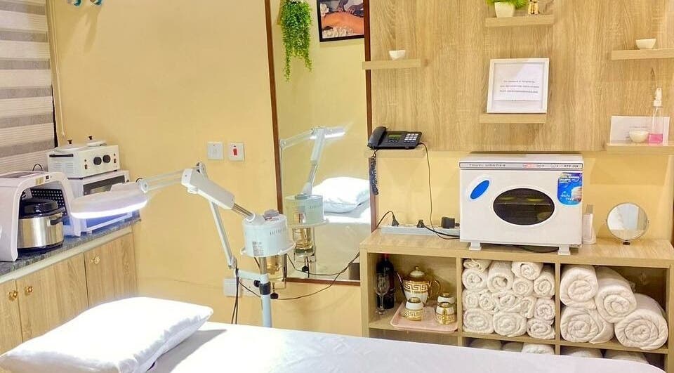 Relaxing treatment room at Moglow Beauty Spa, Abuja, Federal Capital Territory, NG, featuring modern equipment.