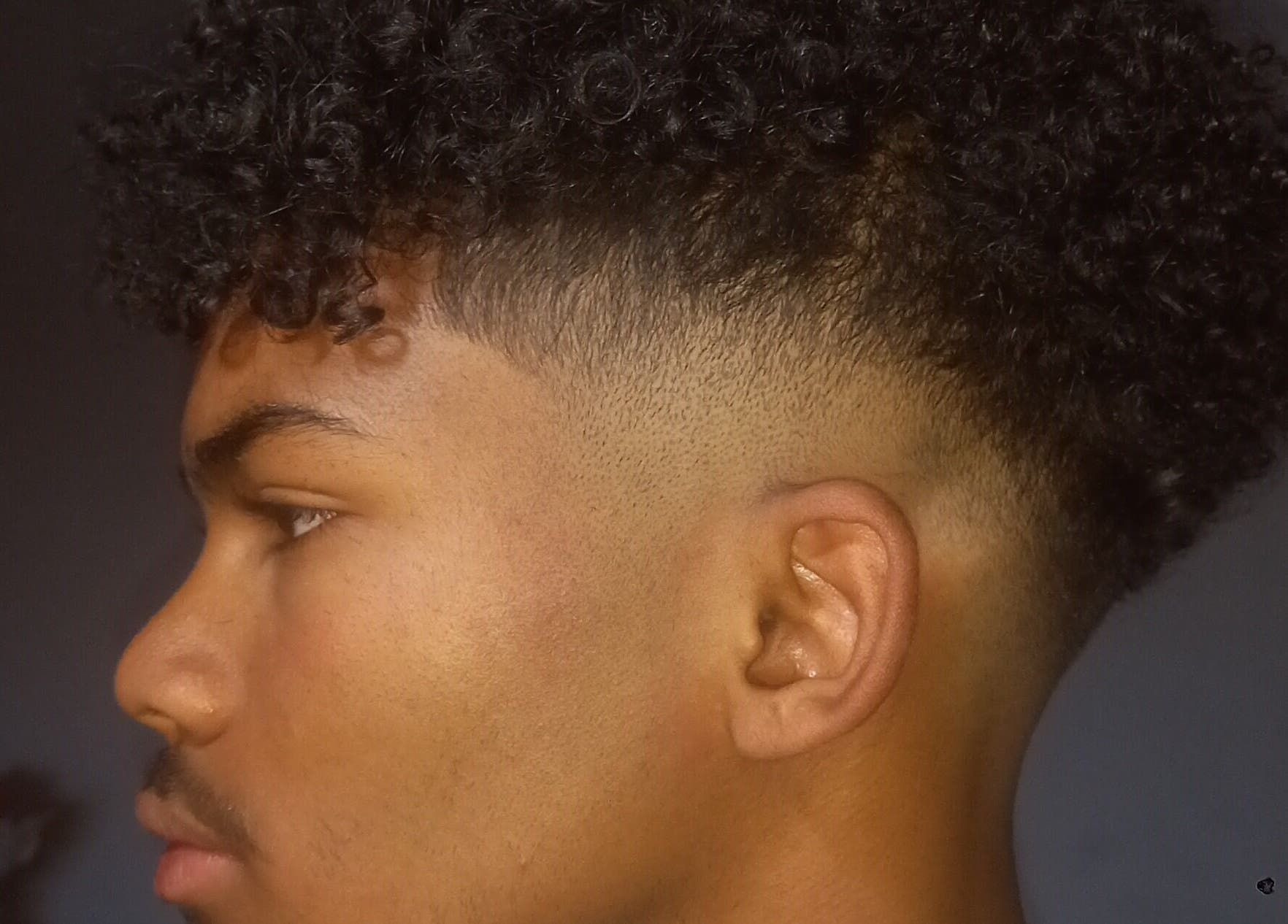 Stylish curly fade haircut at Seth's Parlor, Cape Town, Western Cape, ZA.