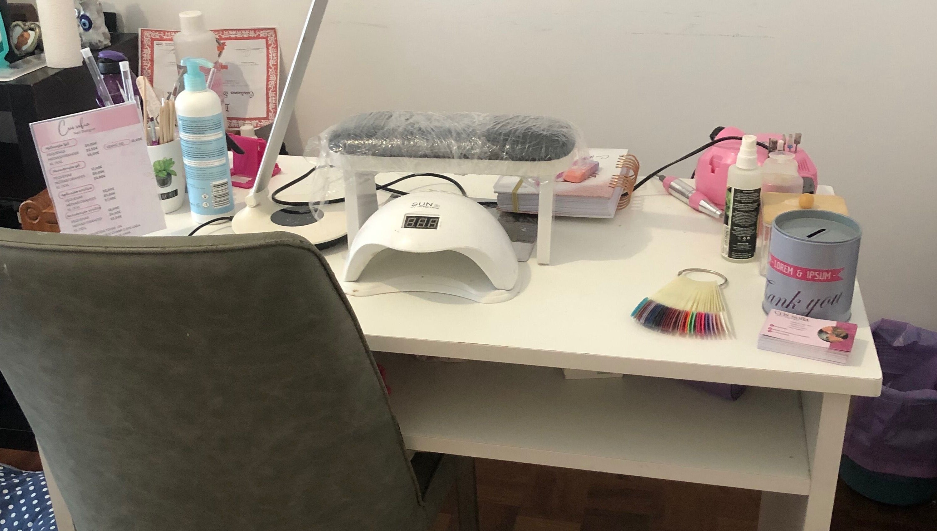 Manicure station at Nails cris in Camarate, Lisboa, PT with nail tools and polish samples.