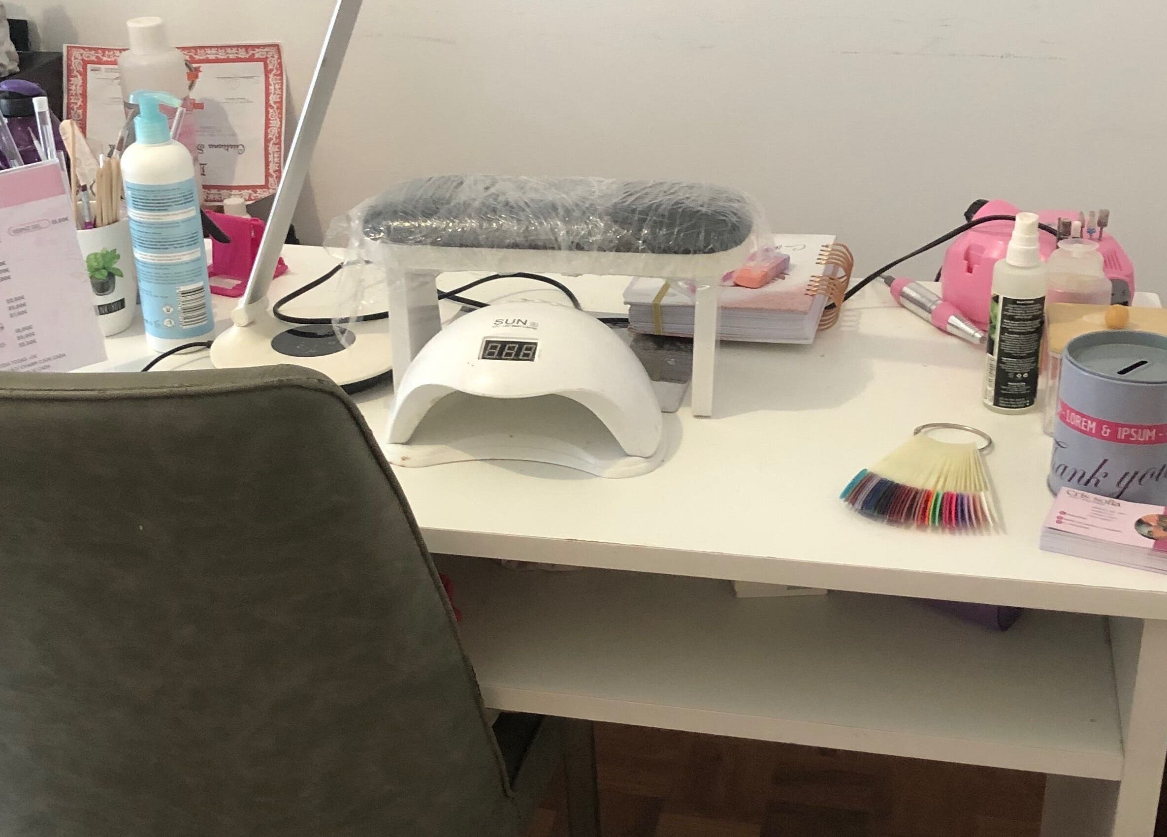 Manicure station at Nails cris in Camarate, Lisboa, PT with nail tools and polish samples.