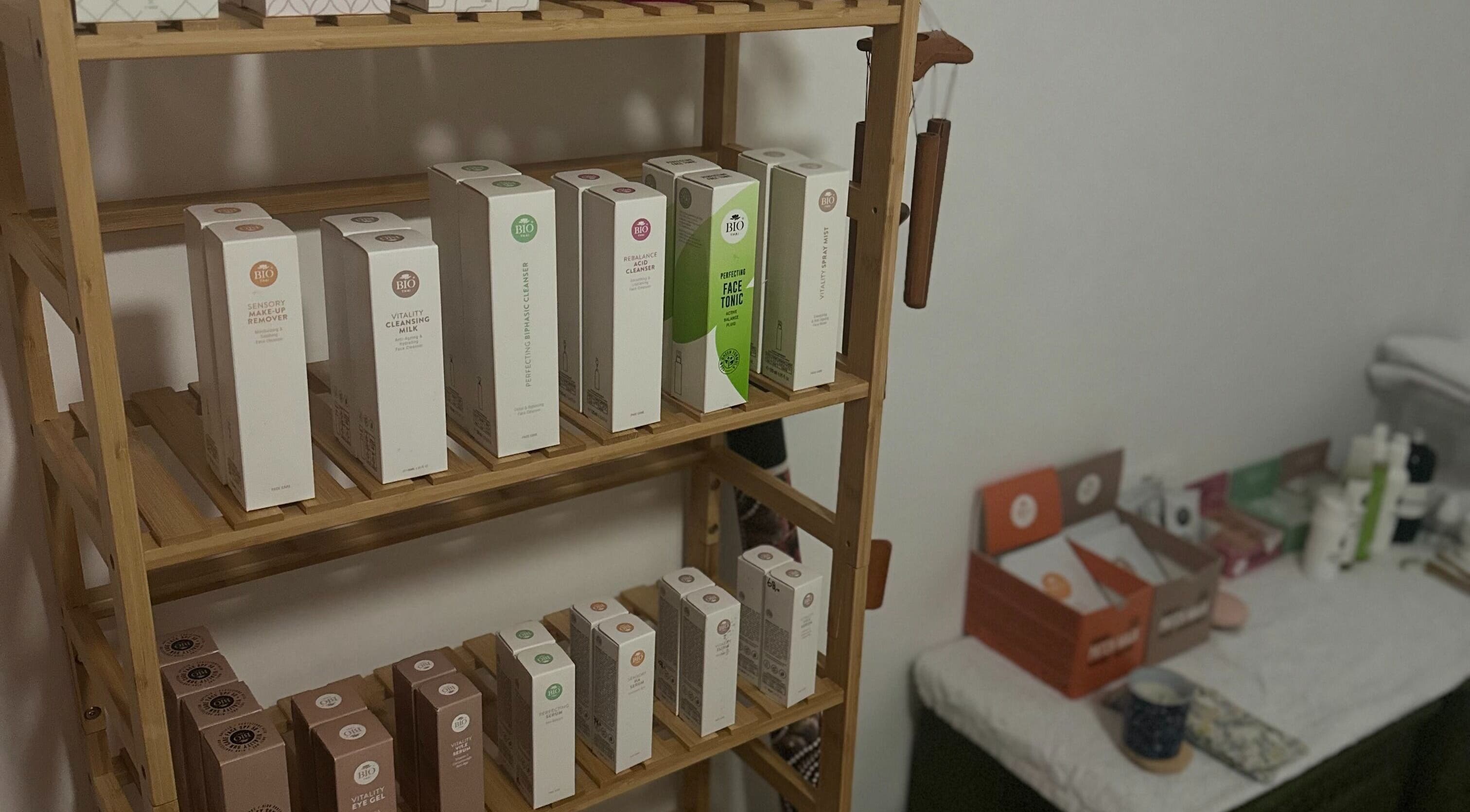 Beauty products displayed on wooden shelves at Head and Soul Spa Costa Blanca in JÁVEA, Comunidad Valenciana, ES.