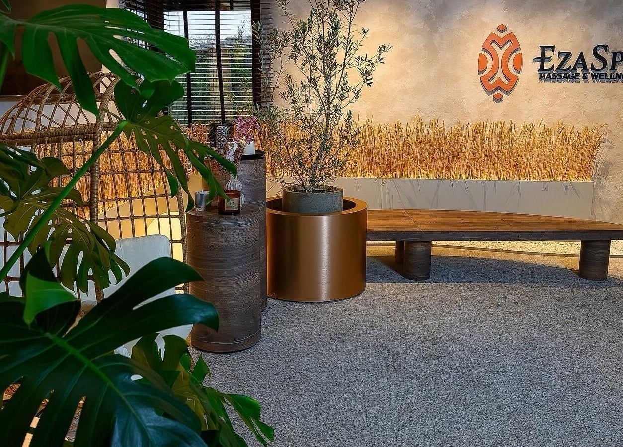 EzaSpa entrance with lush plants and seating in București, București, RO creating a serene ambiance.