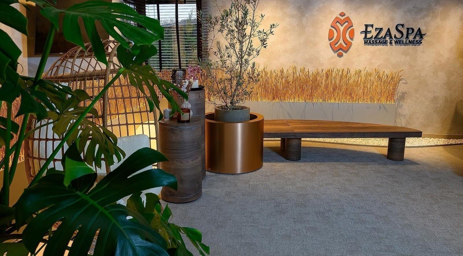 EzaSpa entrance with lush plants and seating in București, București, RO creating a serene ambiance.