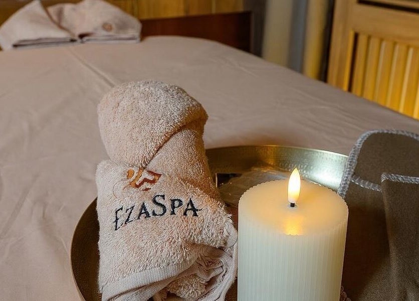 Relaxing spa setup with candle, towels branded EzaSpa, București, București, RO.