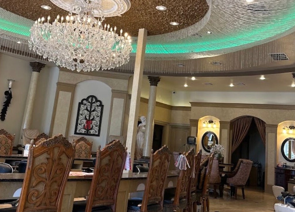 Luxurious interior of Shellac nail & spa in Oklahoma City, Oklahoma, US with elegant chandelier and decor.