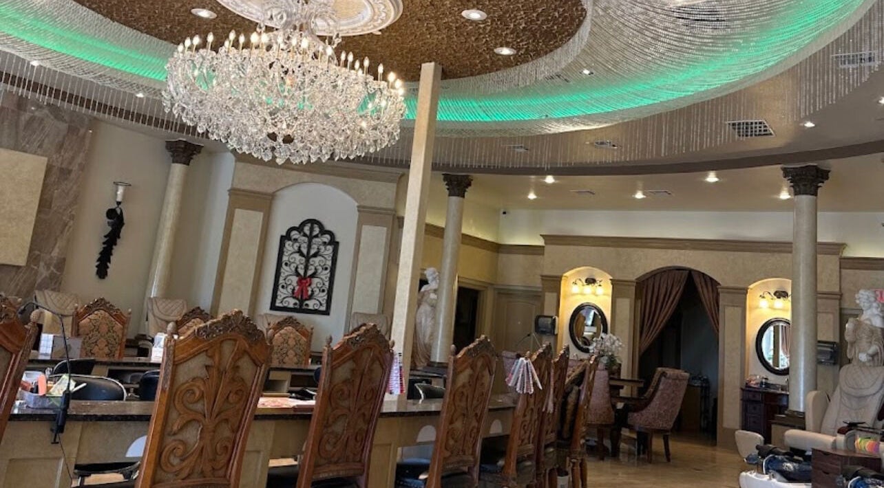 Luxurious interior of Shellac nail & spa in Oklahoma City, Oklahoma, US with elegant chandelier and decor.