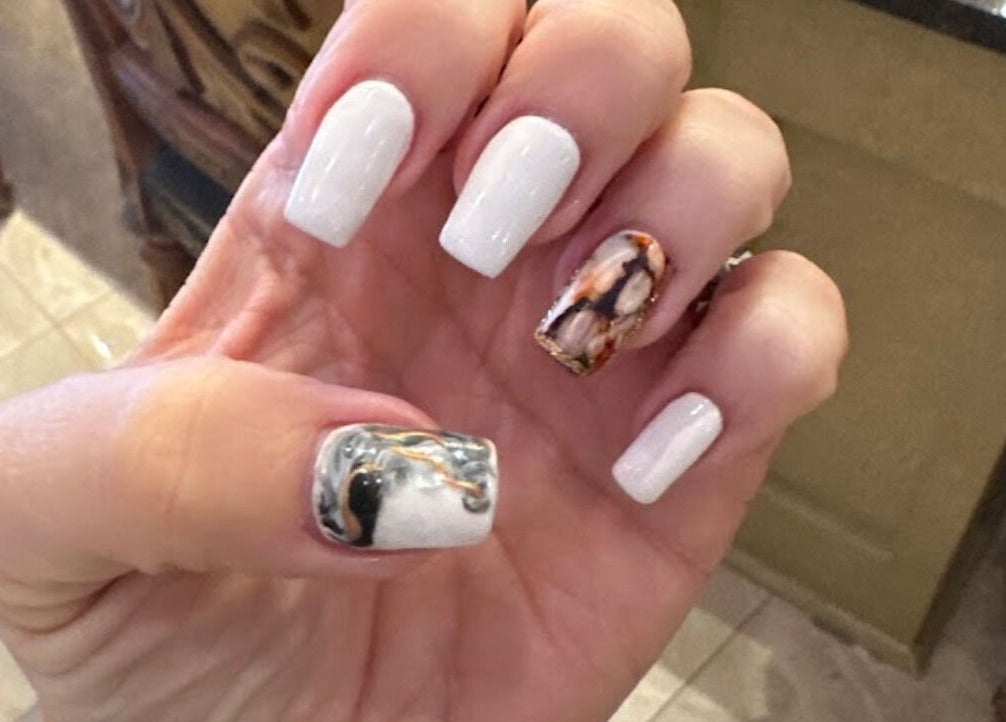 Elegant marble nail art at Shellac nail & spa in Oklahoma City, Oklahoma, US.