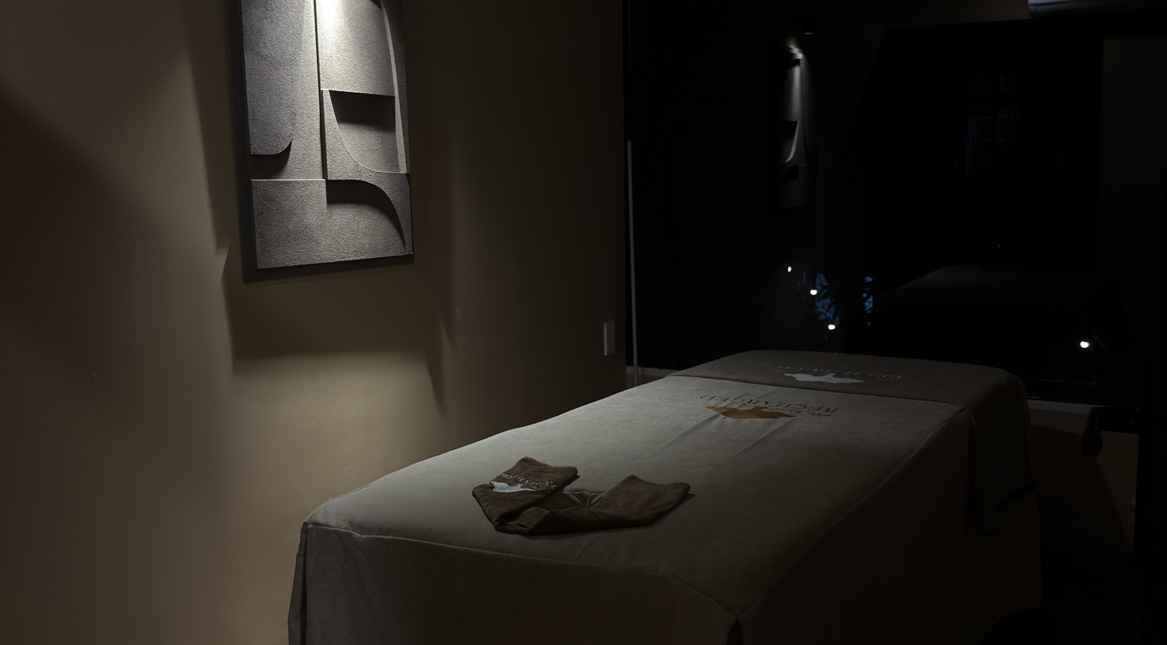 Tranquil massage room at Recharged SPA, Đà Nẵng, Đà Nẵng, VN, featuring dim lighting and soothing decor.