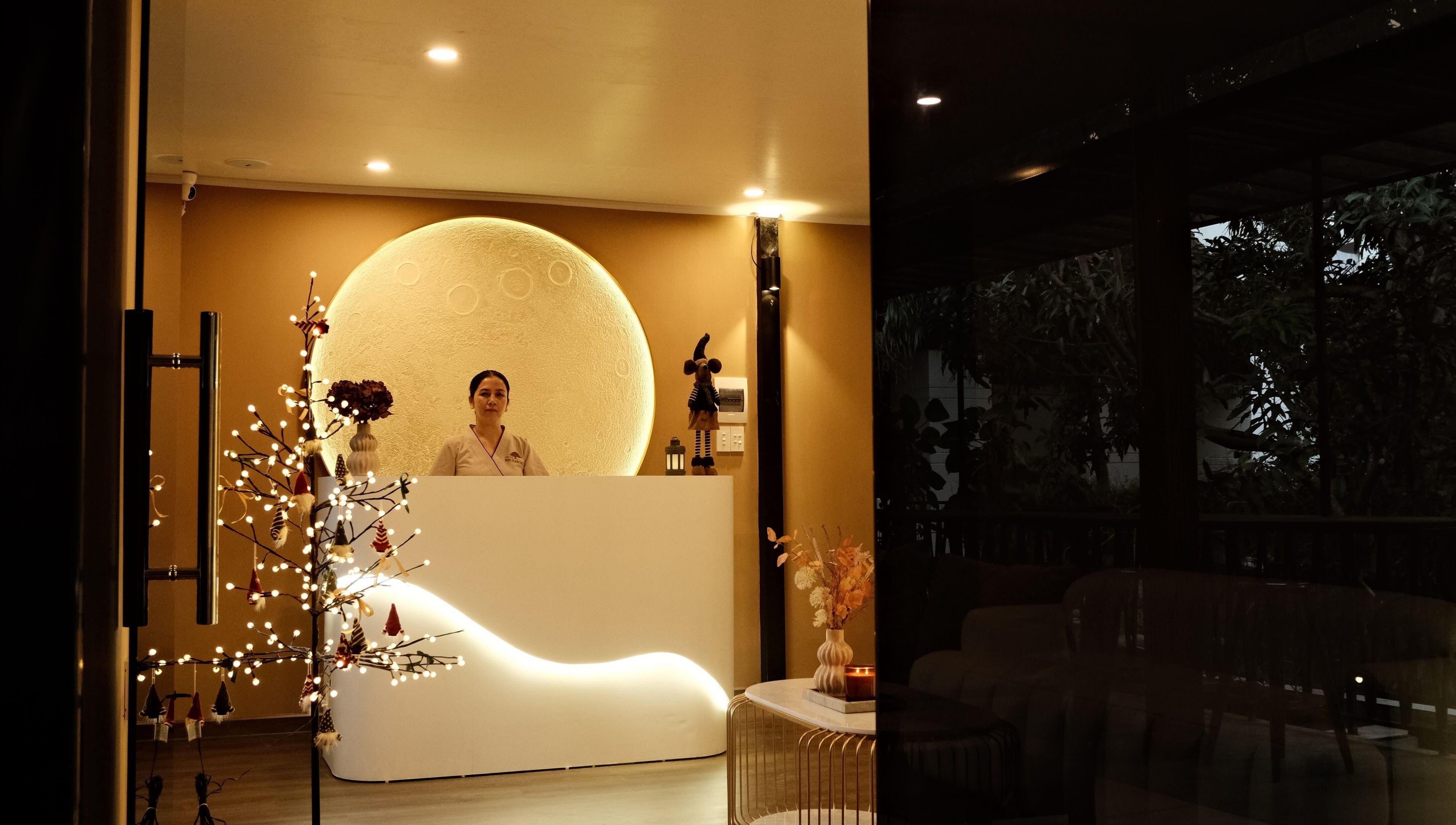 Warmly lit reception at Recharged SPA, Đà Nẵng, Đà Nẵng, VN, welcoming guests with elegant decor.