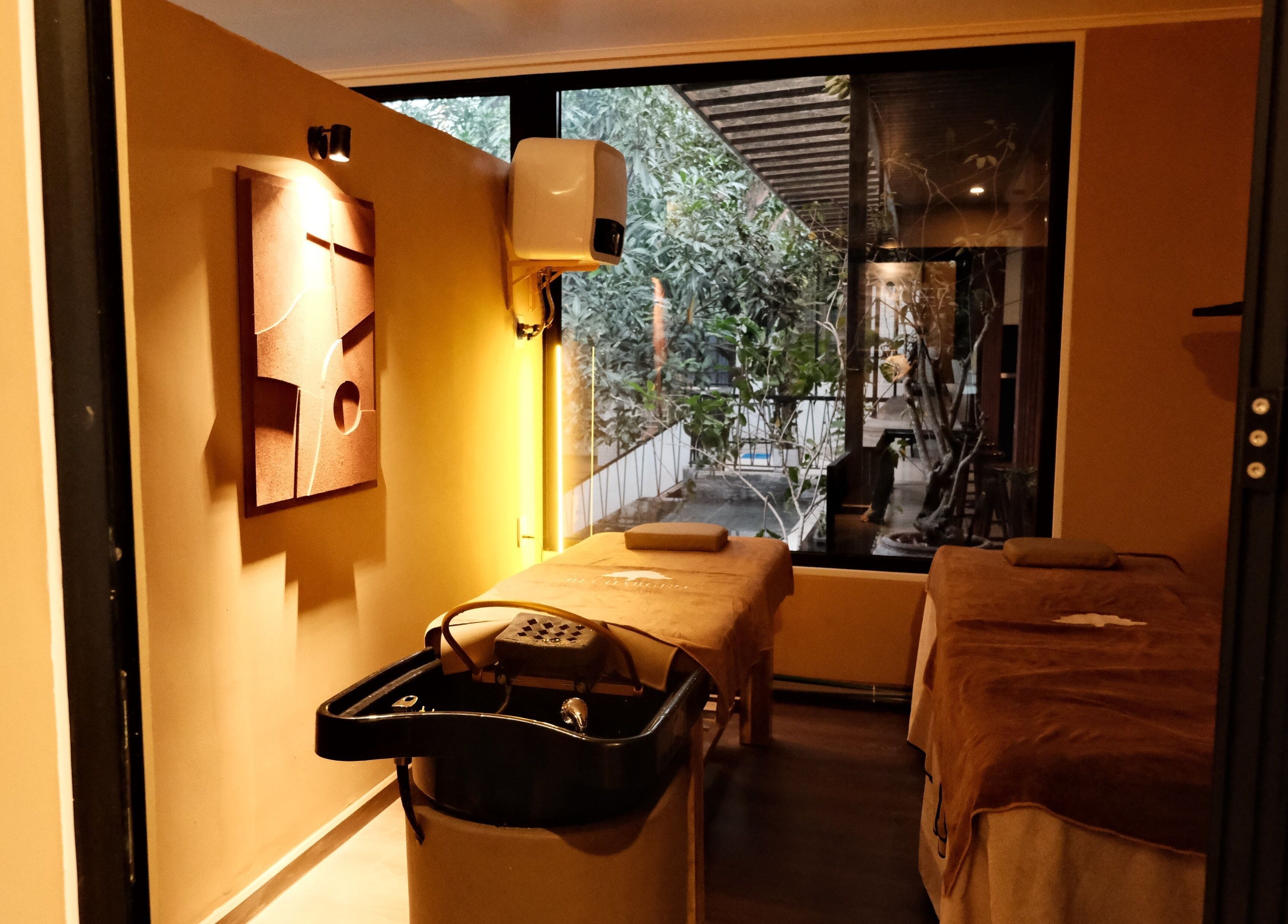 Relaxing massage room at Recharged SPA, Đà Nẵng, Đà Nẵng, VN, featuring tranquil views and cozy decor.