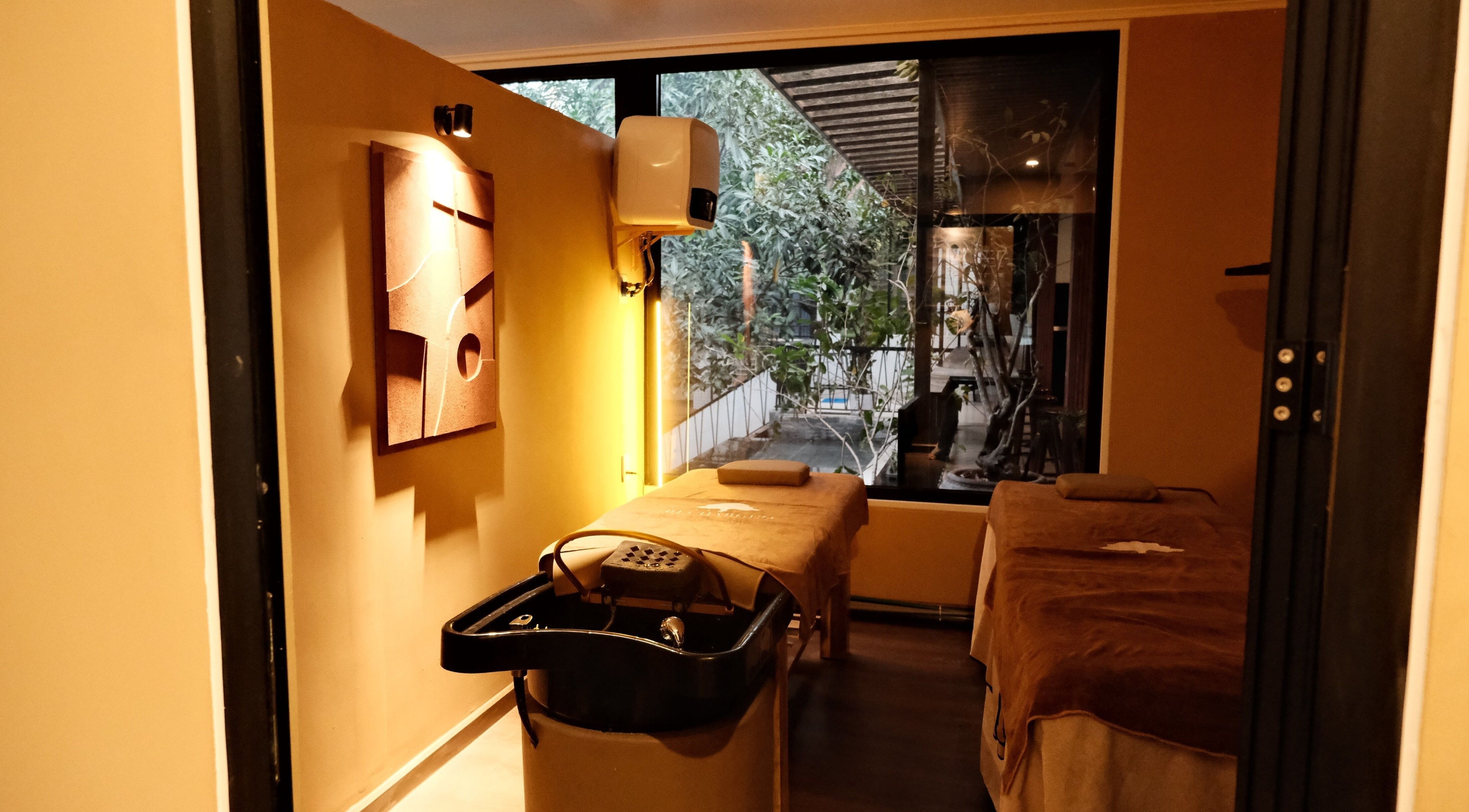 Tranquil massage room at Recharged SPA, Đà Nẵng, Đà Nẵng, VN, with a large window and modern decor.