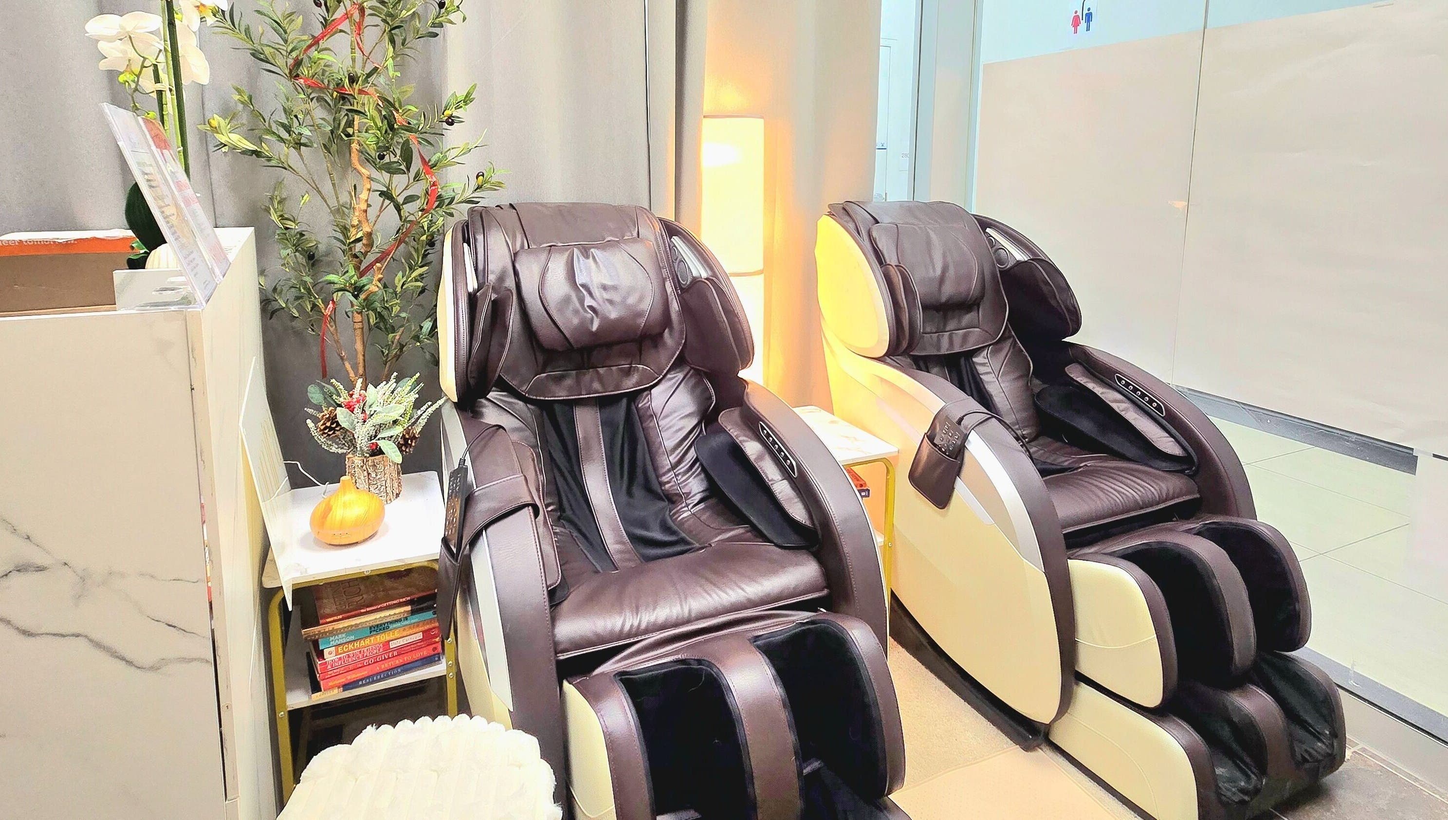 Luxury massage chairs at Emira Ethereal Wellness in Markham, Ontario, CA offer the ultimate relaxation experience.
