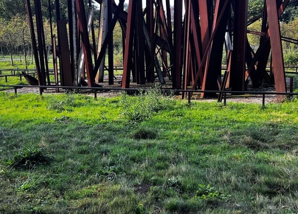 Artful steel structure in a green park at barbershop, Genk, Vlaanderen, BE.