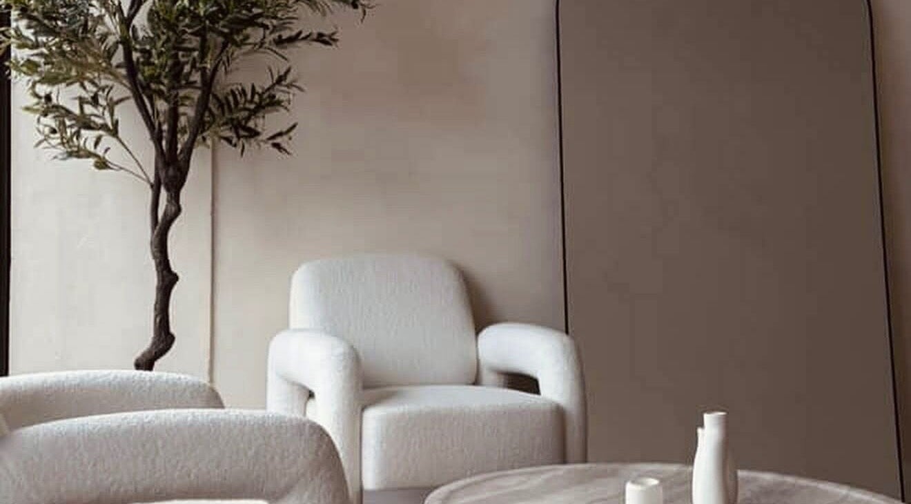 Elegant seating area with plush chairs at Beauty Works, Miami, Florida, US, featuring serene decor.