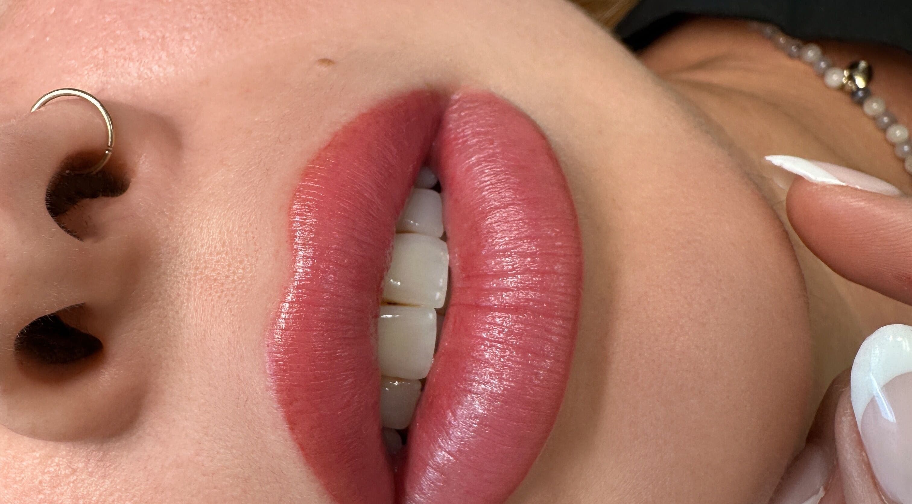 Close-up of beautifully enhanced lips at Beauty Works, Miami, Florida, US.