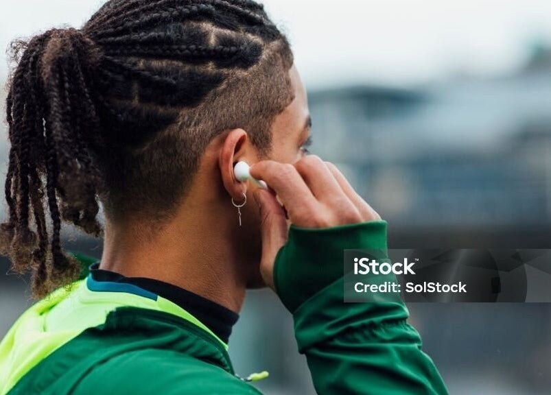 Man with stylish braids at Dan Hair Style, Birmingham, England, GB.