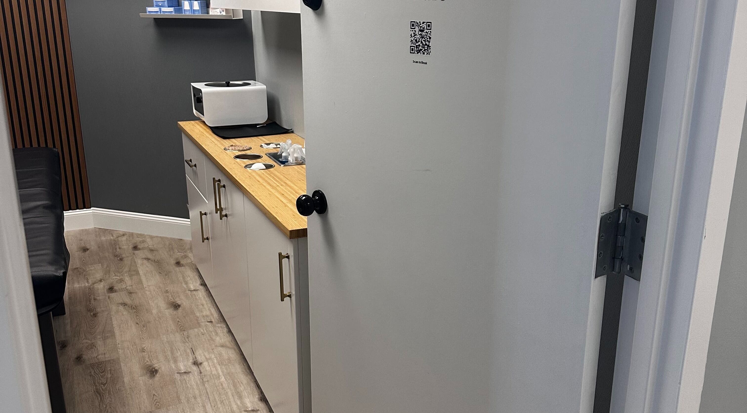 Cozy waxing room at Pro Wax Studio in Oradell, New Jersey, US with modern decor and warm ambiance.