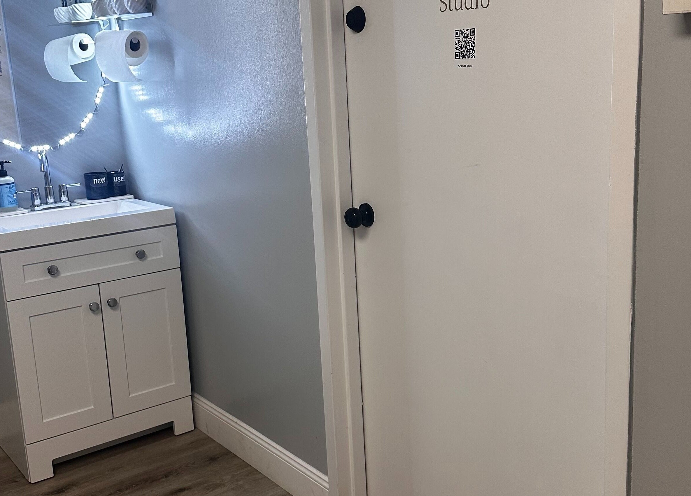 Bright and modern vanity area at Pro Wax Studio in Oradell, New Jersey, US, showcasing sleek design and lighting.