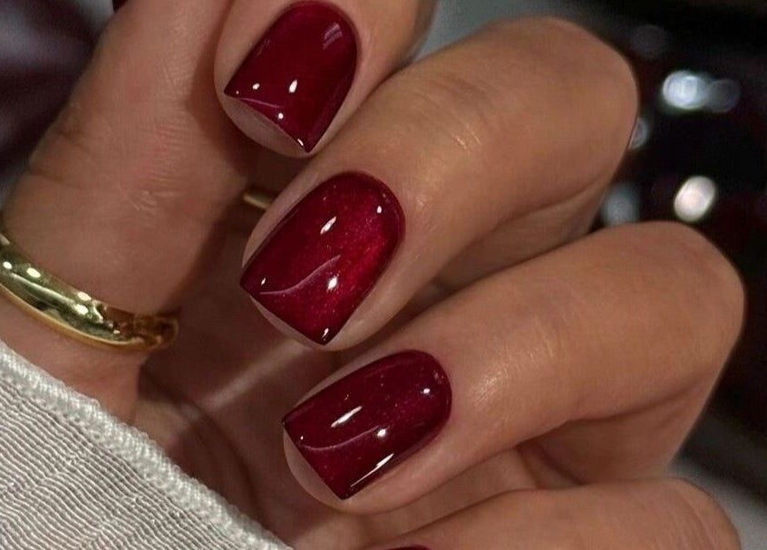 Elegant red manicure at UR HONESTY BEAUTY CO. STUDIO, Roodepoort, Gauteng, ZA. Perfect for style and sophistication.