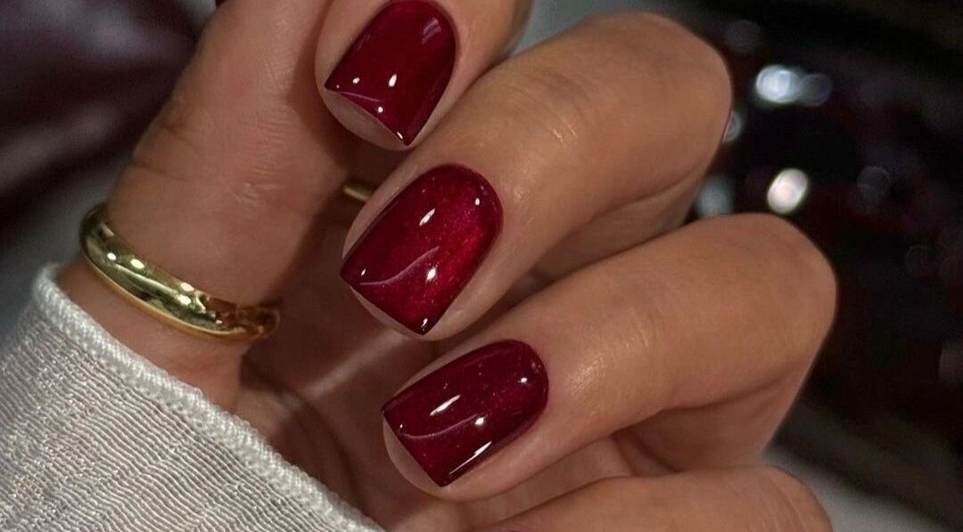 Elegant red manicure at UR HONESTY BEAUTY CO. STUDIO, Roodepoort, Gauteng, ZA. Perfect for style and sophistication.