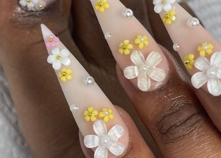Detailed floral nail art at UR HONESTY BEAUTY CO. STUDIO, Roodepoort, Gauteng, ZA, showcasing intricate designs.