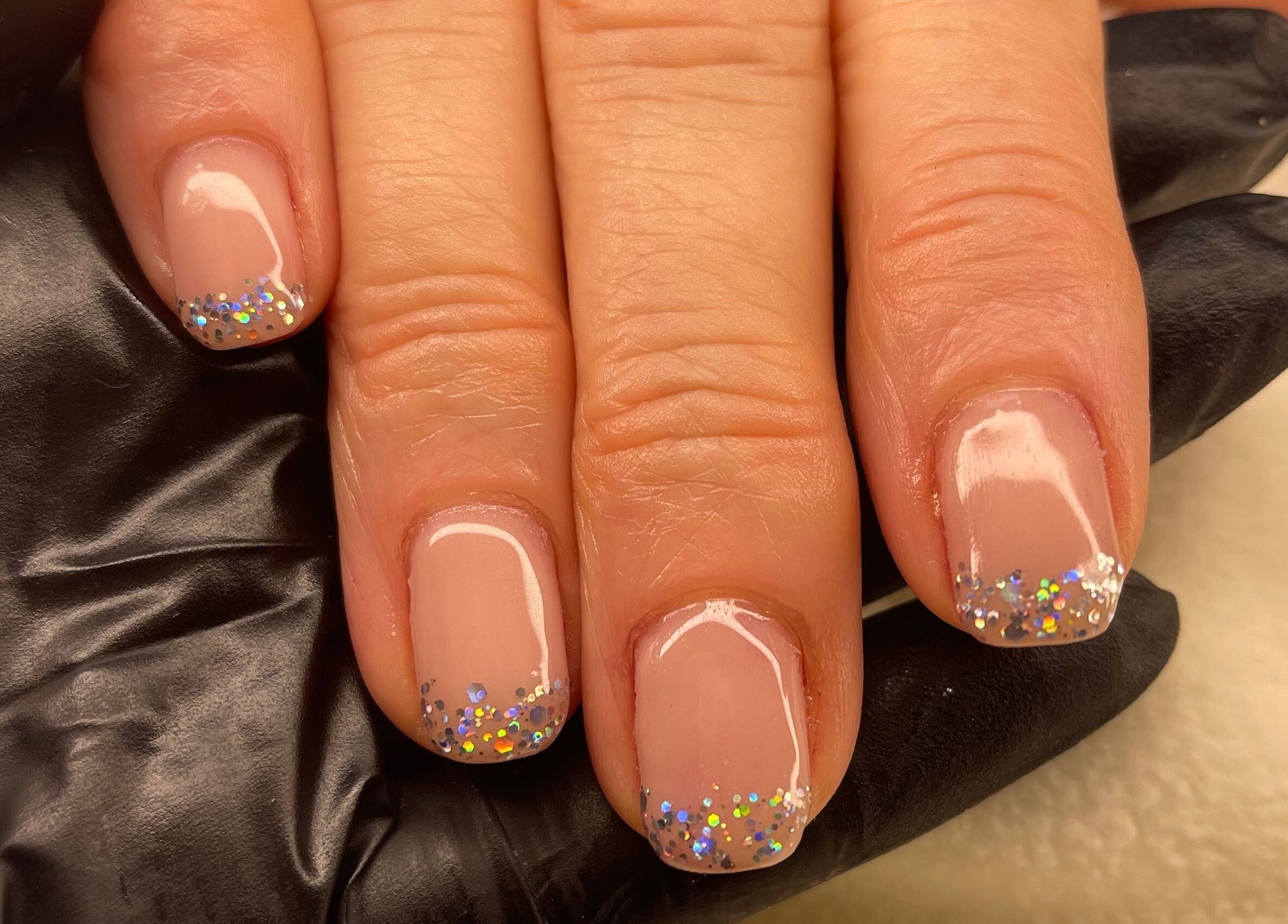 Glittery nail art at Coco’s Beauty in Clanfield, England, GB.