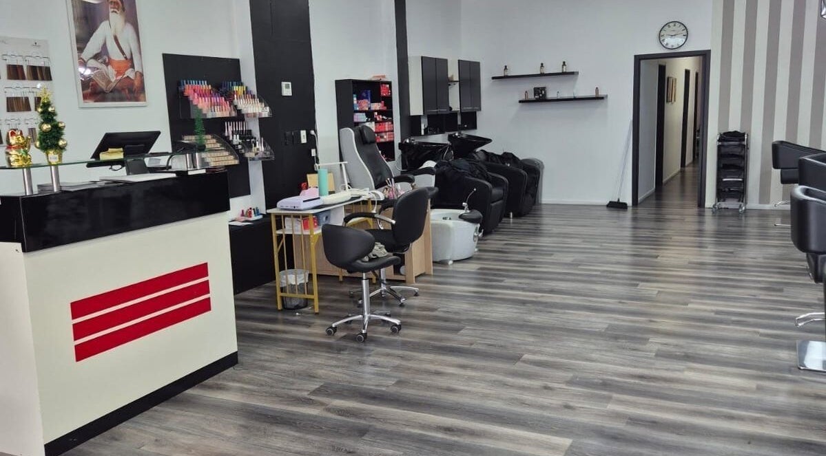 Inviting interior of Luxe Hair & Beauty Salon in Hamilton, Waikato Region, NZ with sleek decor and modern chairs.