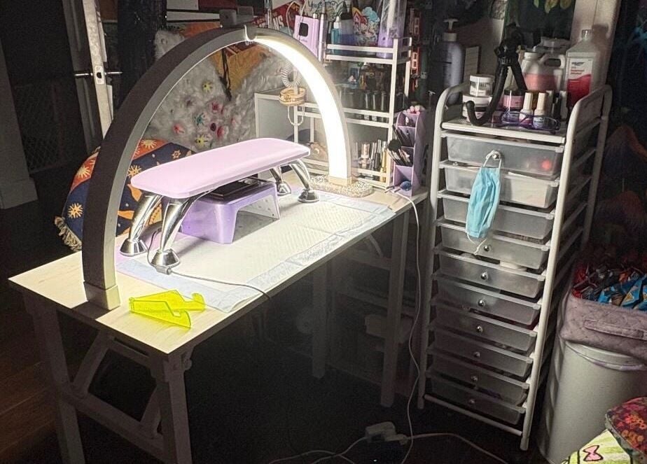 Nail station setup at Kaicrylics, Port Charlotte, Florida, US, showcasing manicure tools and products.