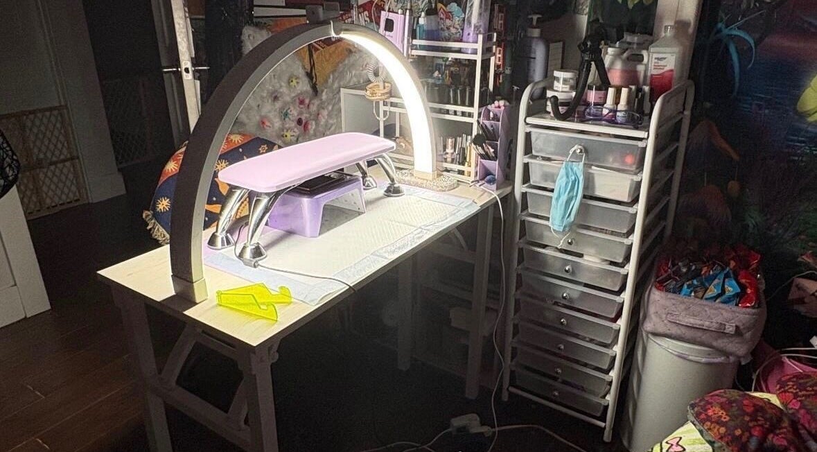 Nail station setup at Kaicrylics, Port Charlotte, Florida, US, showcasing manicure tools and products.