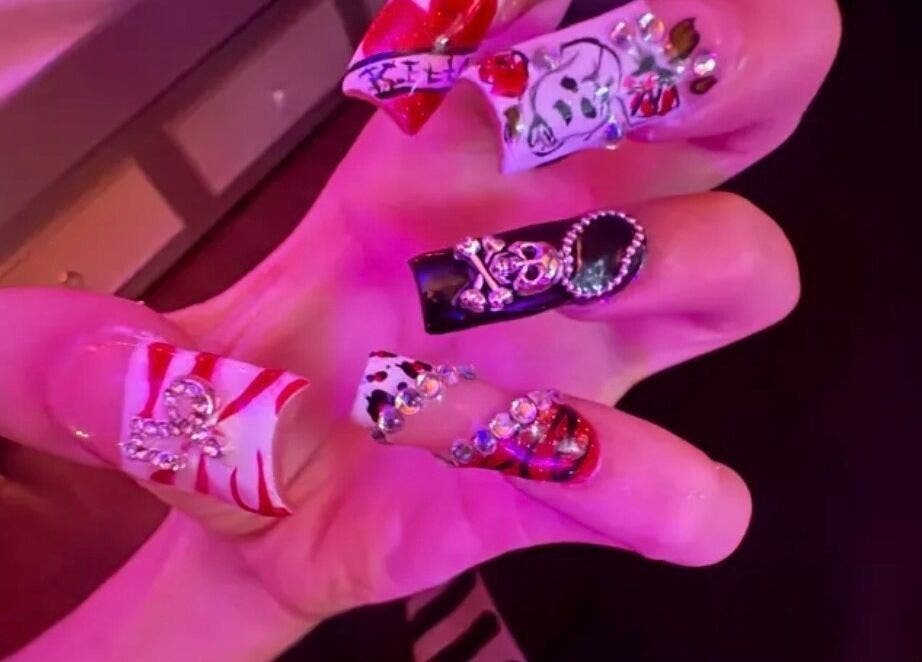 Bold nail art design from Kaicrylics in Port Charlotte, Florida, US with intricate embellishments.