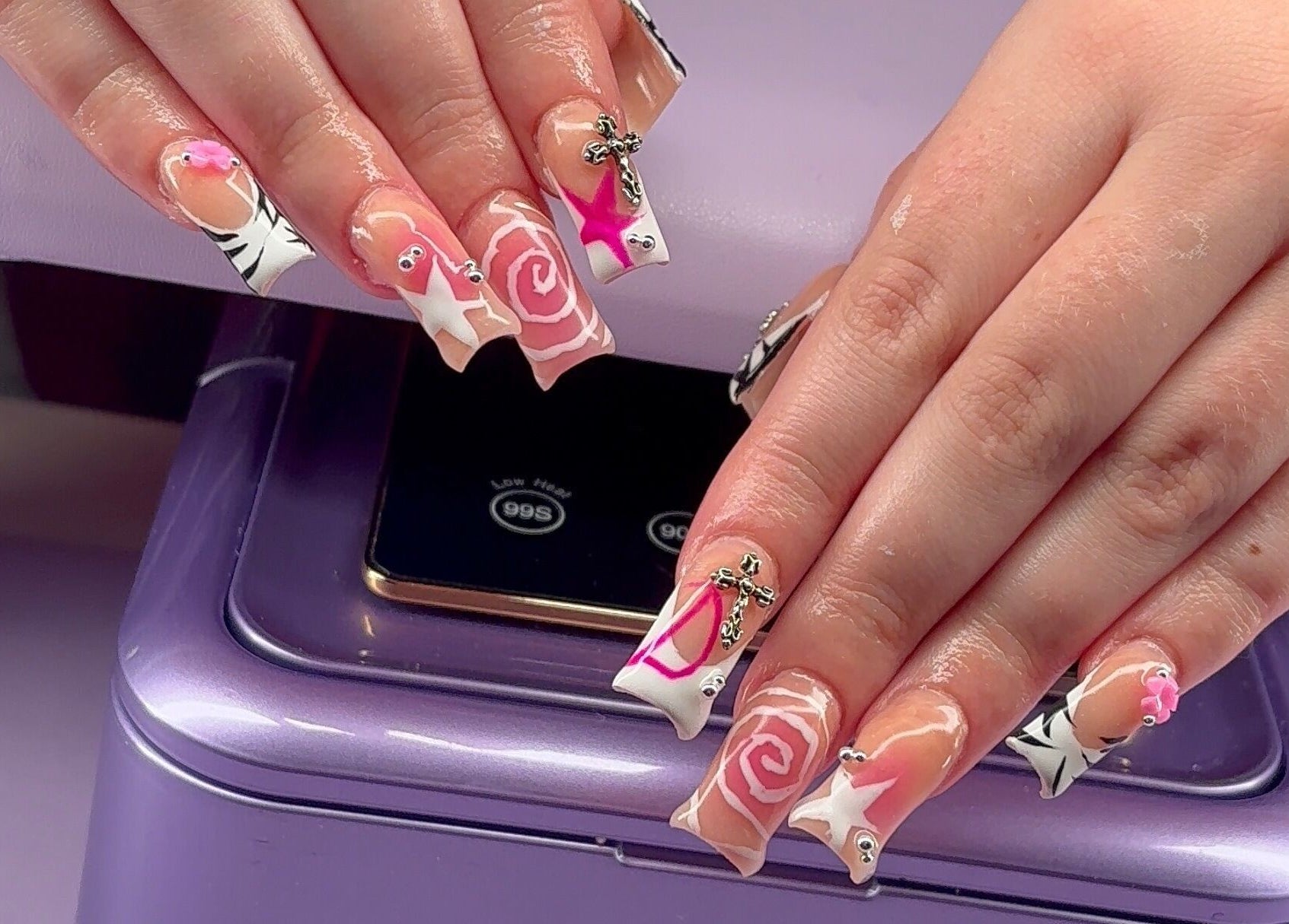 Vibrant nail art at Kaicrylics, Port Charlotte, Florida, US, showcasing intricate designs and vibrant colors.