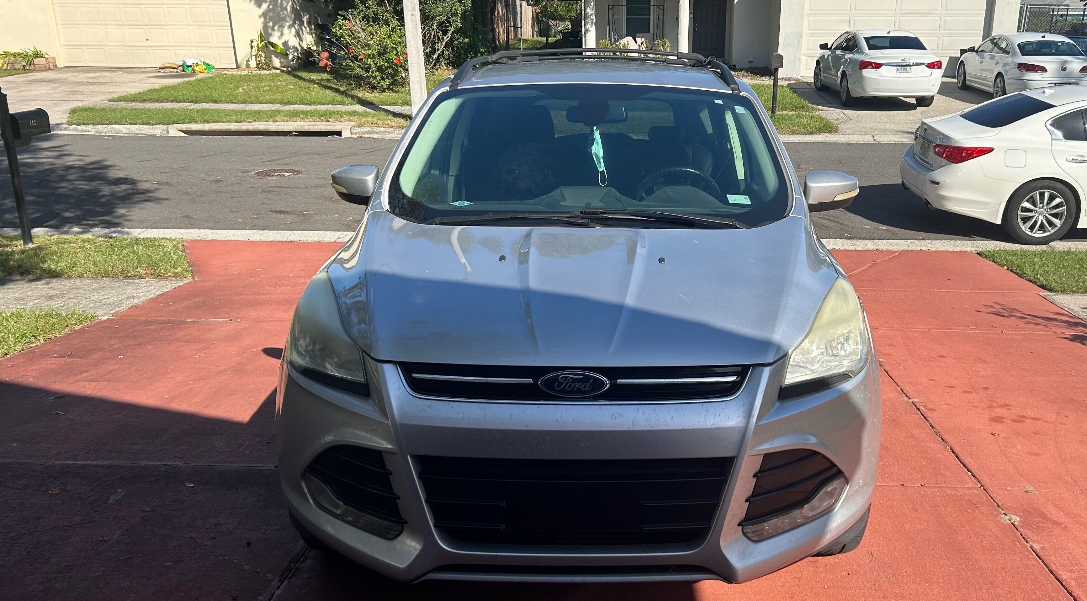 Car parked on a residential driveway near Grant rentals, Auburndale, Florida, US.