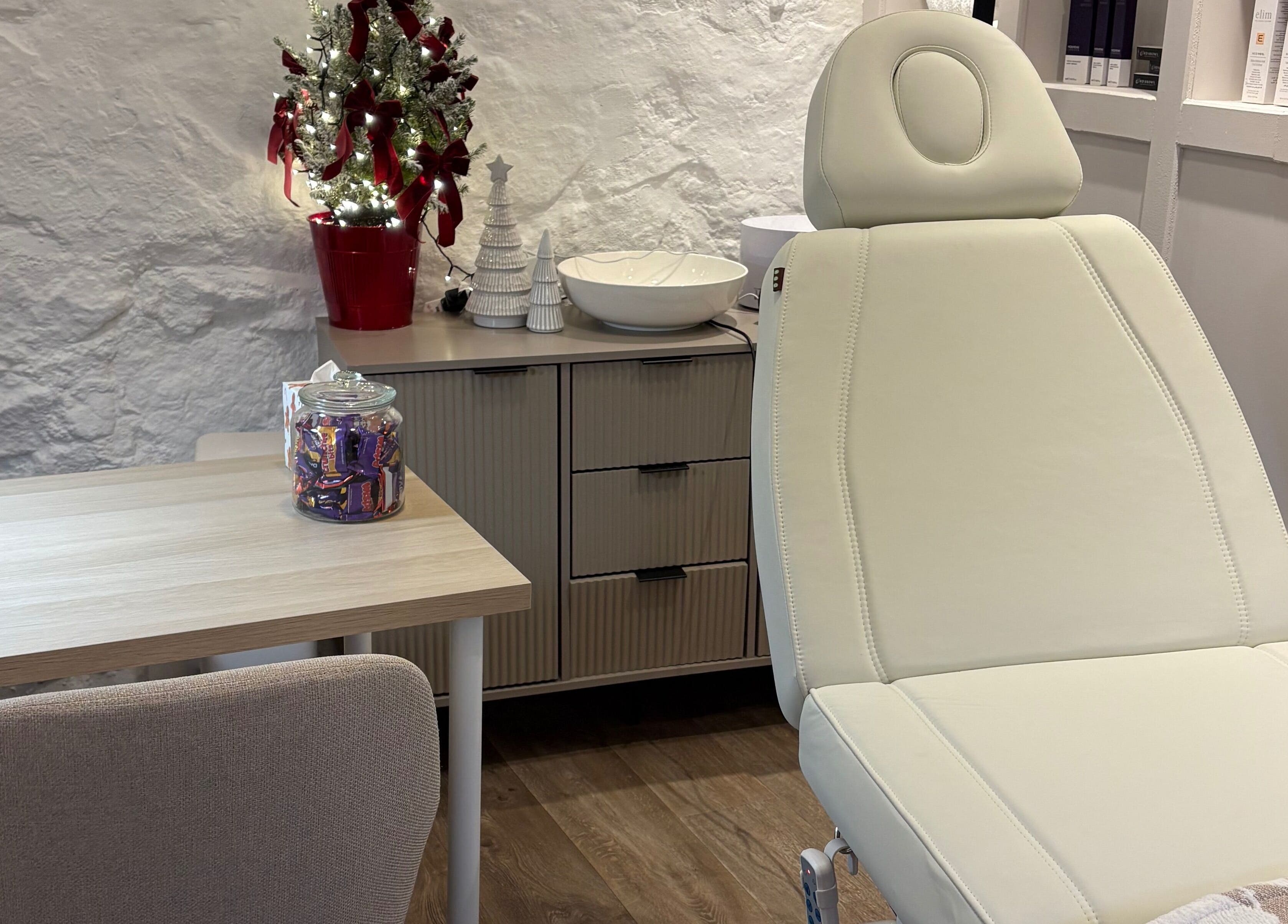 Calming therapy room at Made Creative Beauty, Rothley, England, GB with a cozy chair and festive decor.