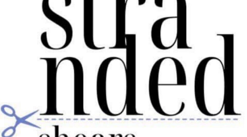 Stranded Shears logo features bold typography and scissors. Located in Mississauga, Ontario, CA.