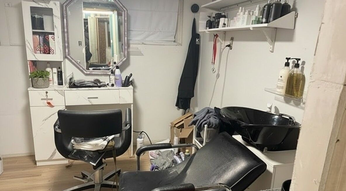 Chic salon setup at Stranded Shears, Mississauga, Ontario, CA featuring styling chair and hair care products.