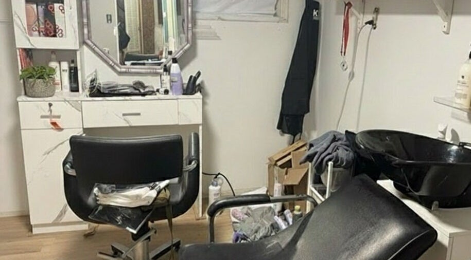 Modern salon chair and washing station at Stranded Shears in Mississauga, Ontario, CA.