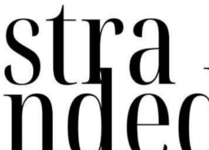 Elegant typography logo of Stranded Shears in Mississauga, Ontario, CA, exuding modern sophistication.