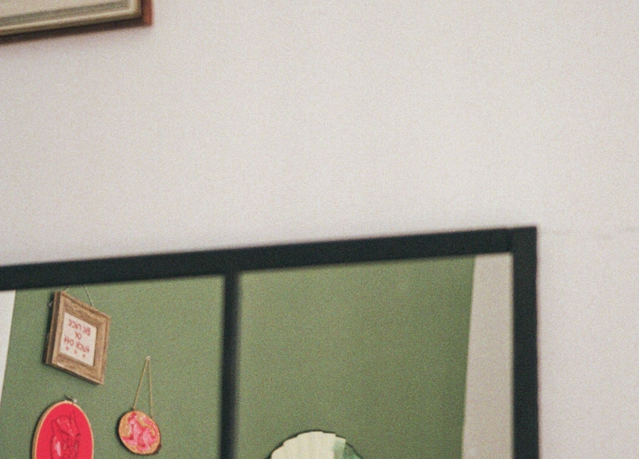 Charming wall decor inside Kate de Tigres, located in Porto, Porto, PT, featuring eclectic art pieces.